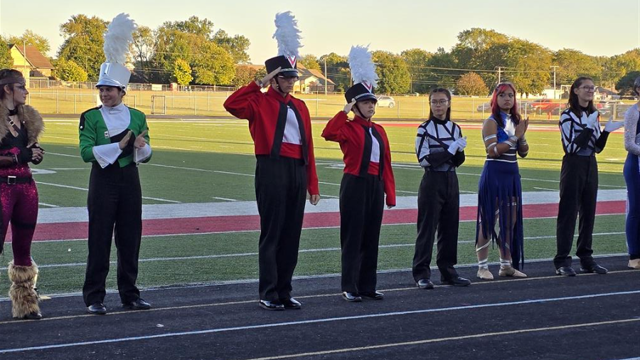 The High School Band seniors (Class of 2026) accepting the band's award at the Plymouth ISSMA Open Class Invitational. 11 October 2025